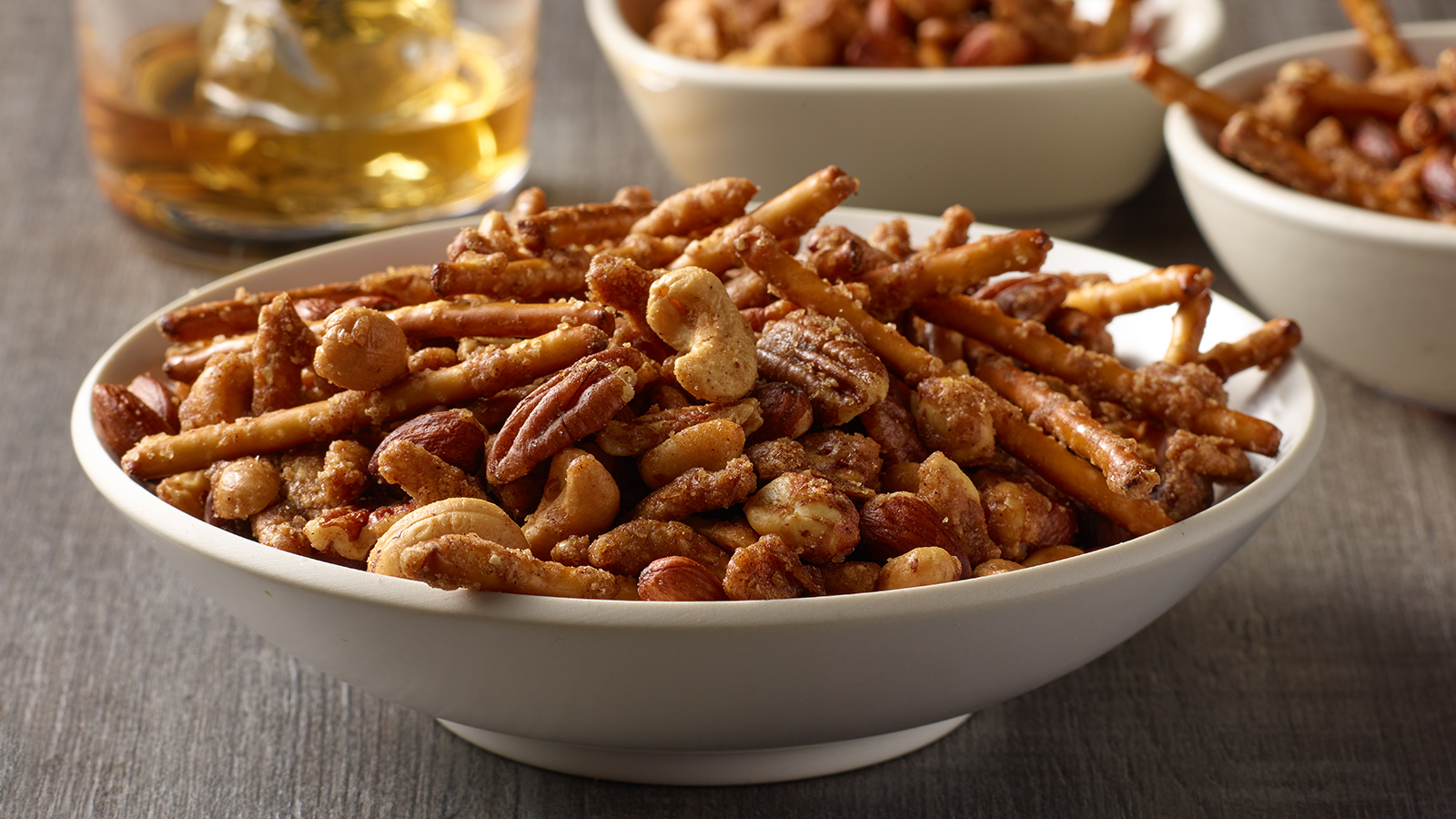 Bowl of winter spiced sweet and savory pretzel snack mix.