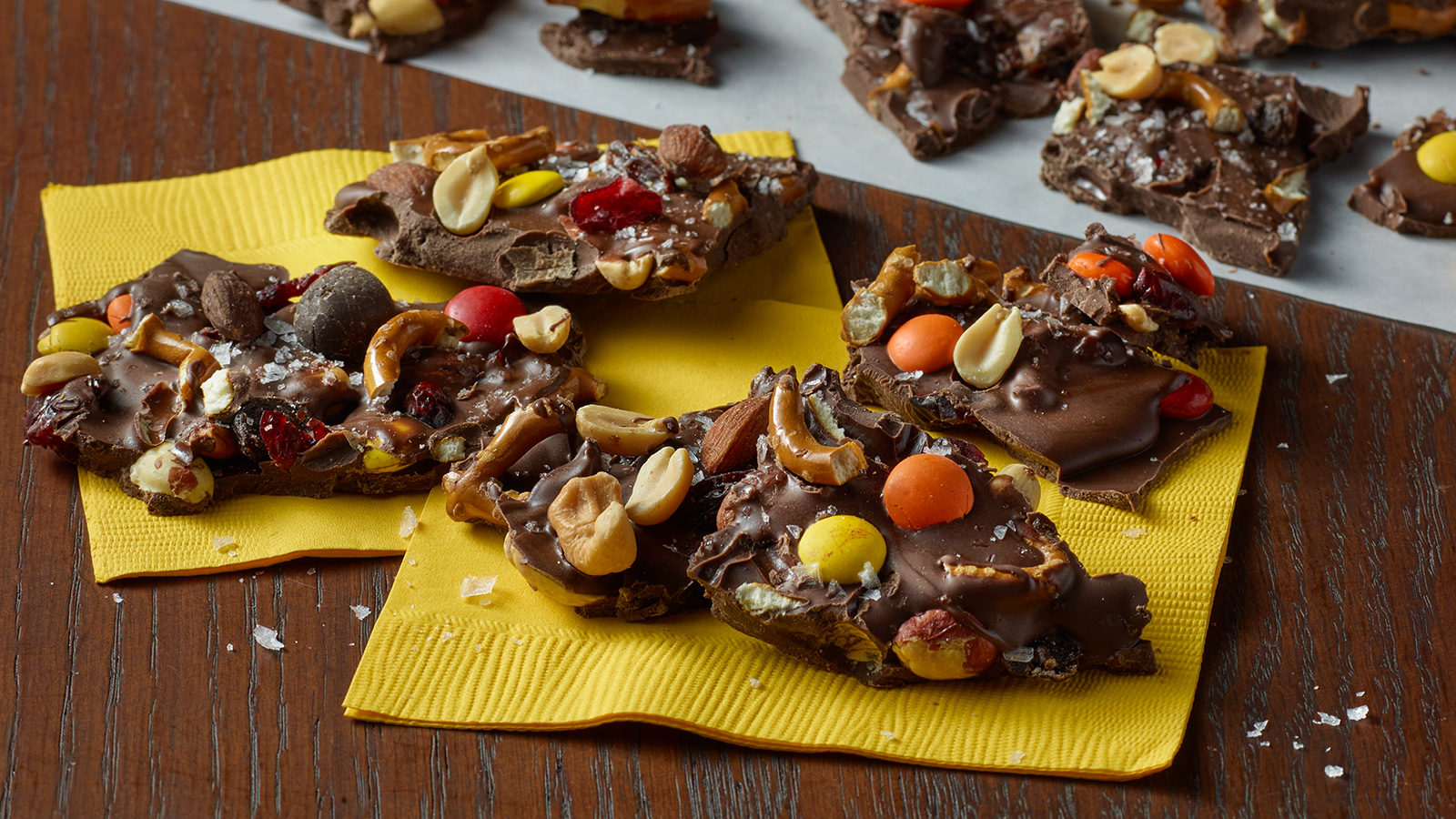 Pieces of sweet and salty harvest chocolate bark on napkins.