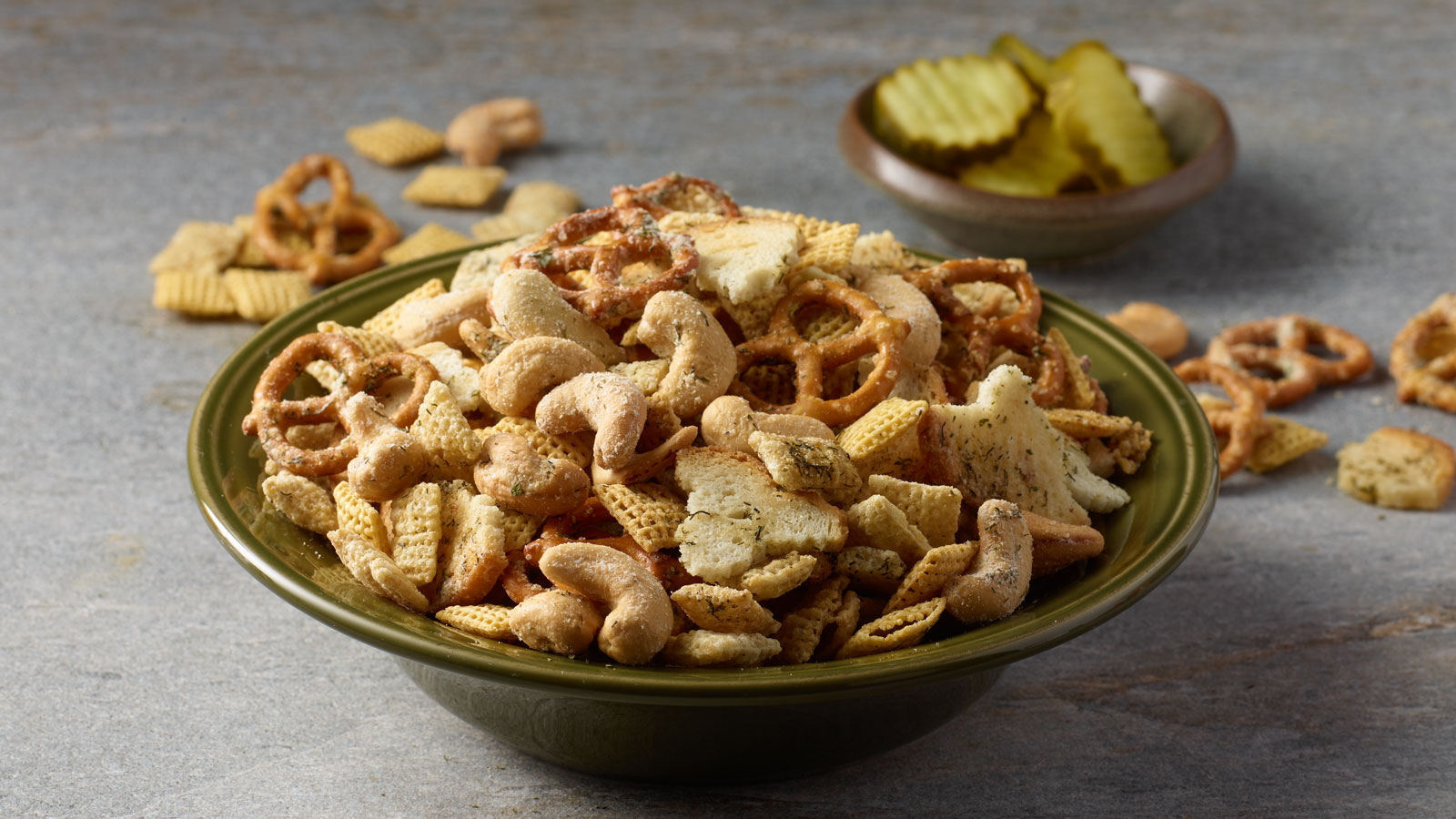 Bowl of PLANTERS dill pickle snack mix.