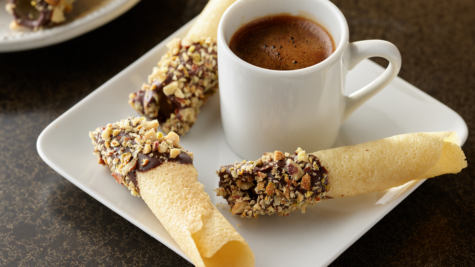 Plate of PLANTERS chocolate dipped tuiles.