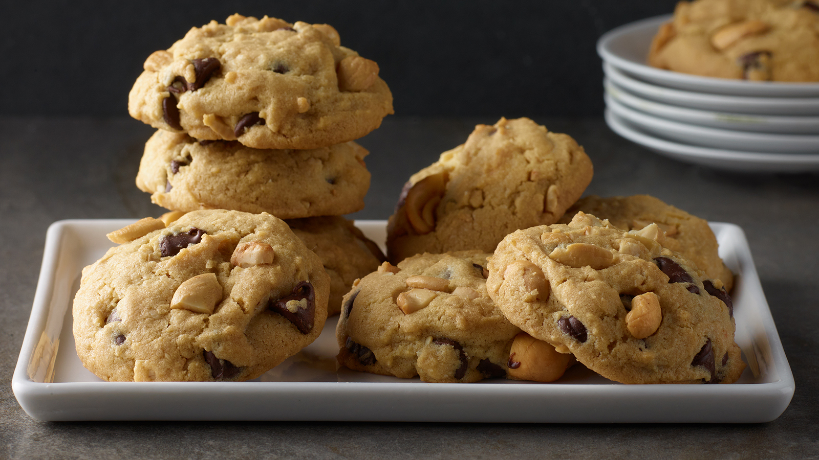 Plate of peanut butter chocolate chip cashew cookies.