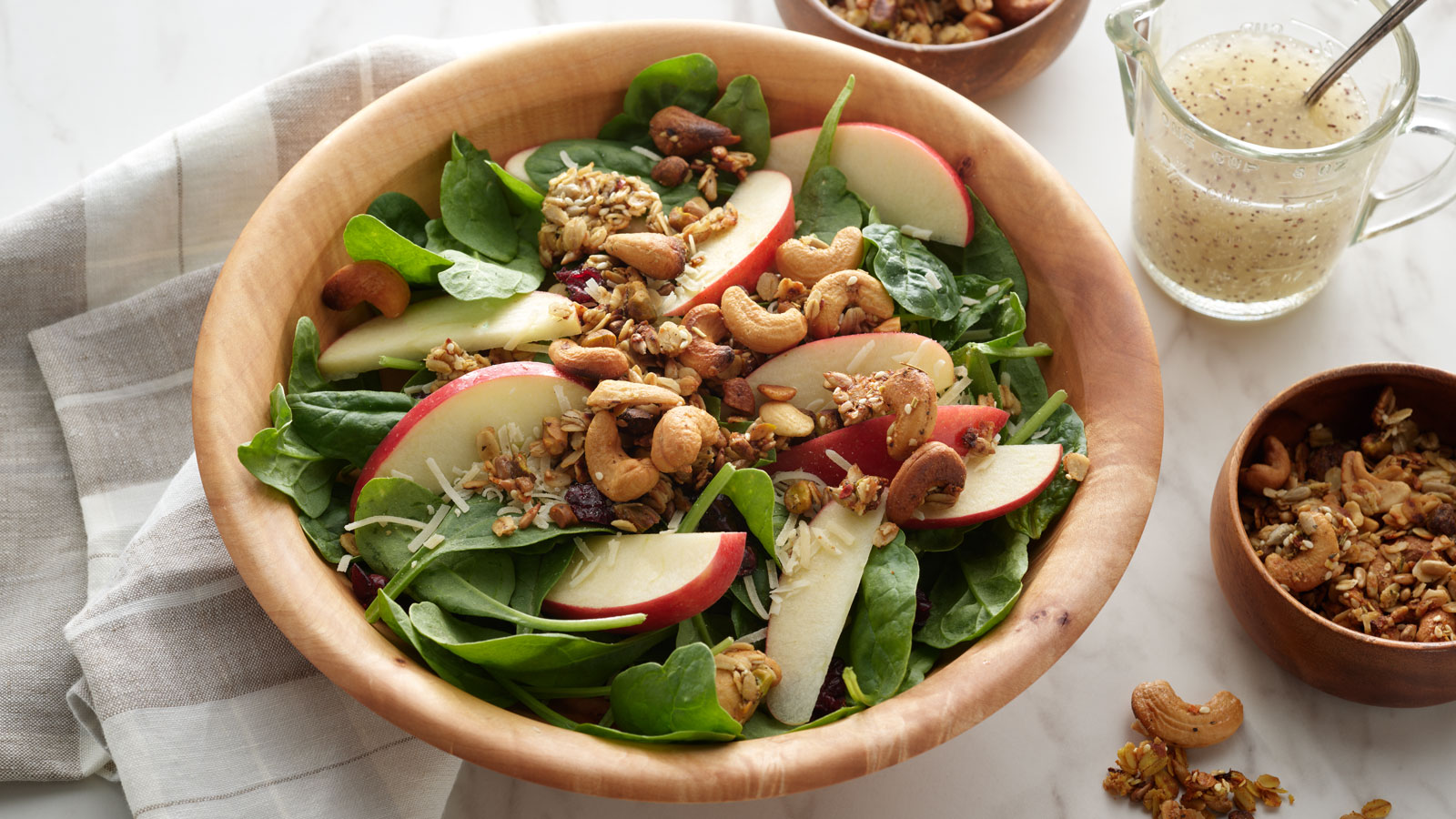 Bowl of Autumn salad with savory granola.