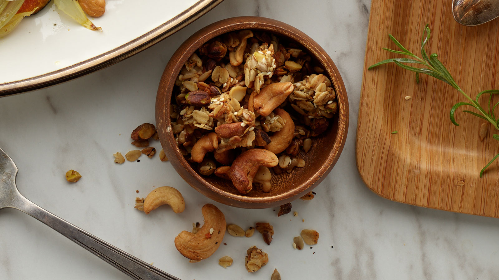 Small bowl of savory rosemary sea salt cashew granola.