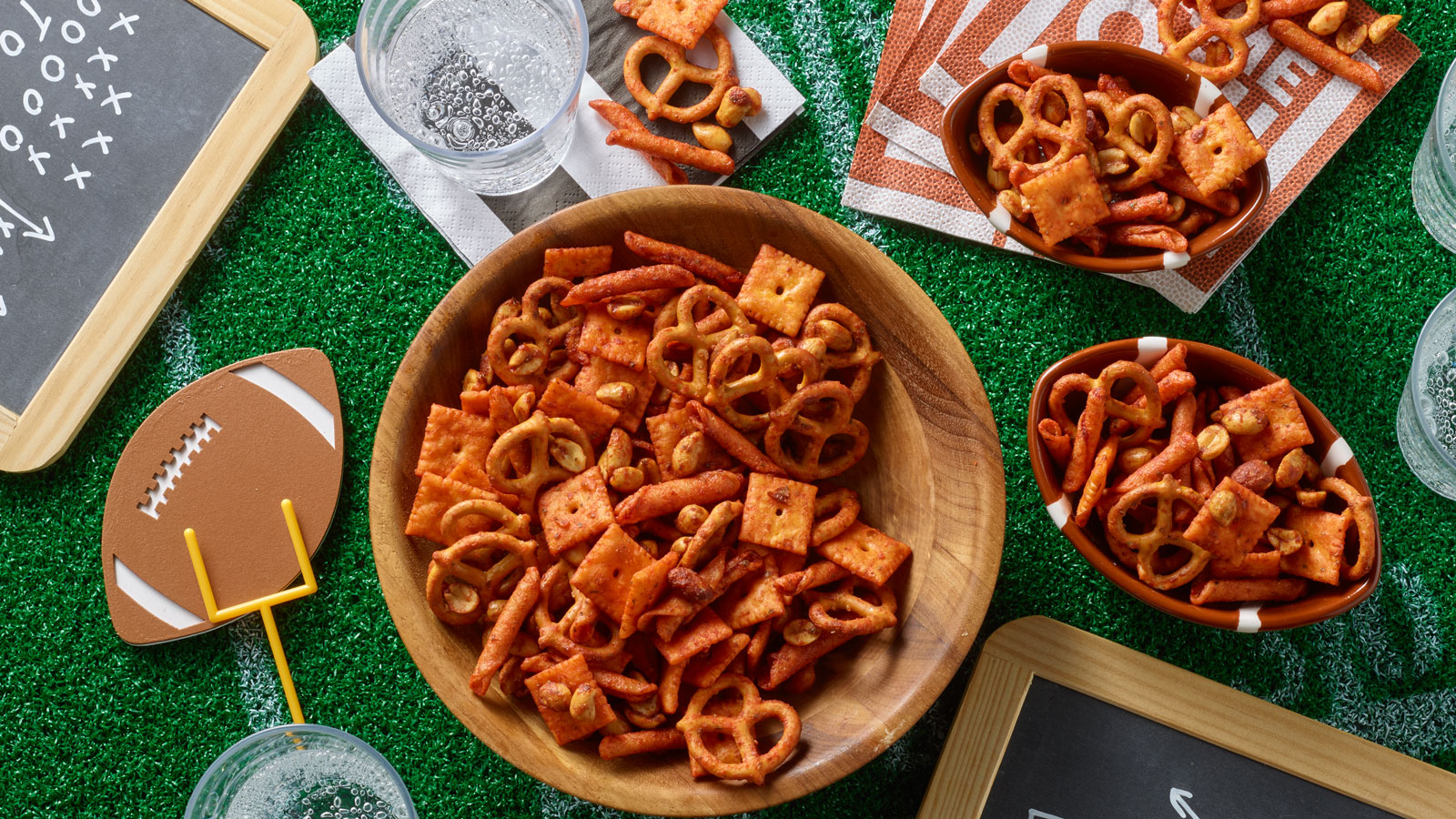 PLANTERS spicy buffalo snack mix with football decor.
