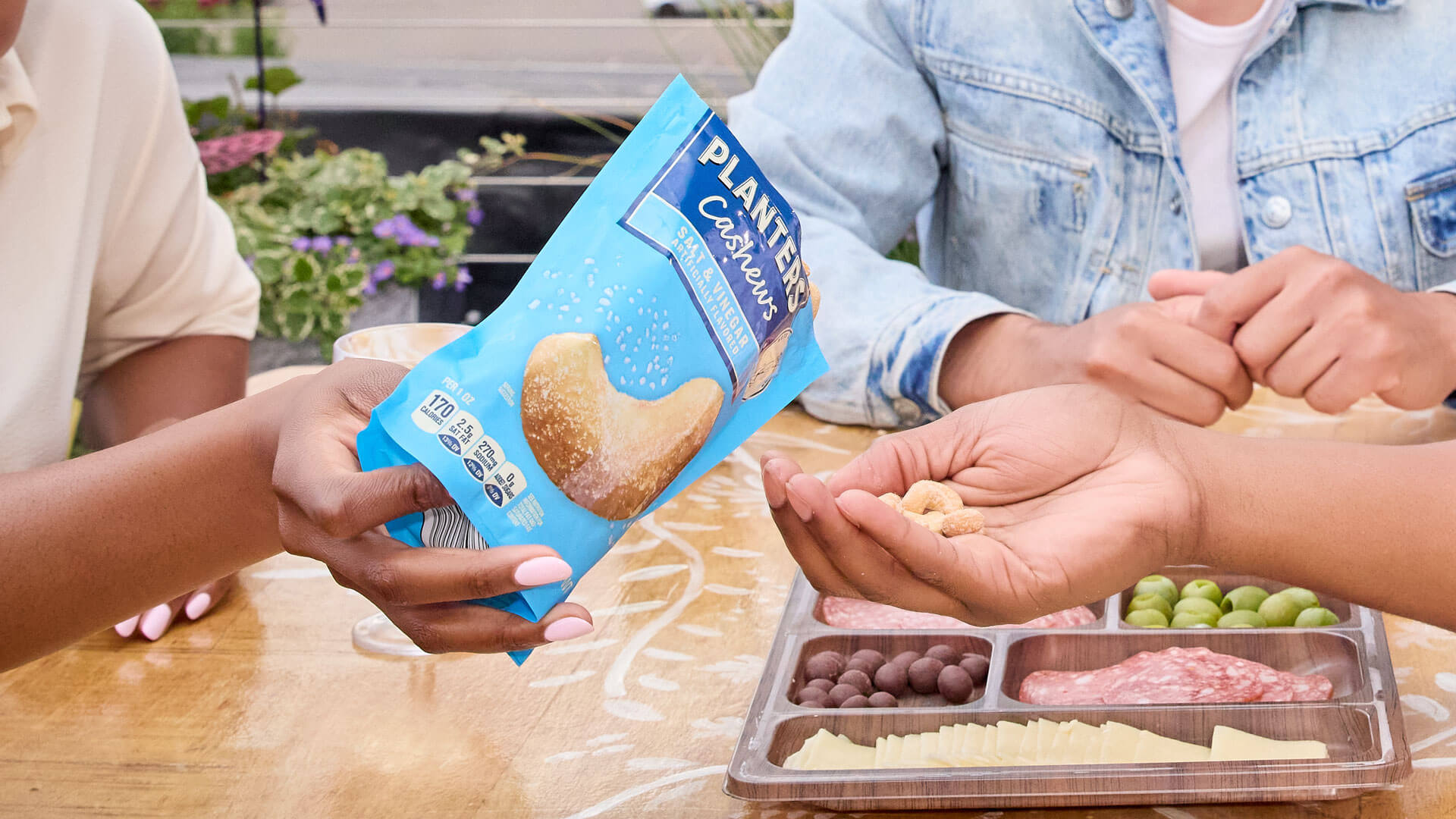 People sharing Planters Salt and vinegar cashews