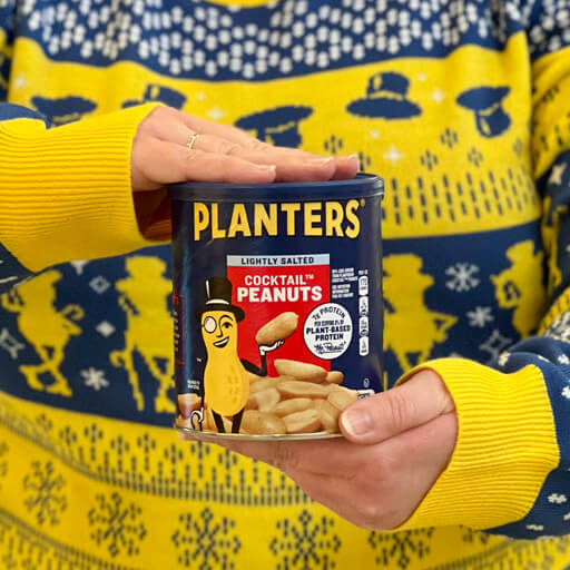 Planters holiday sweaters promotional photo yellow sweater