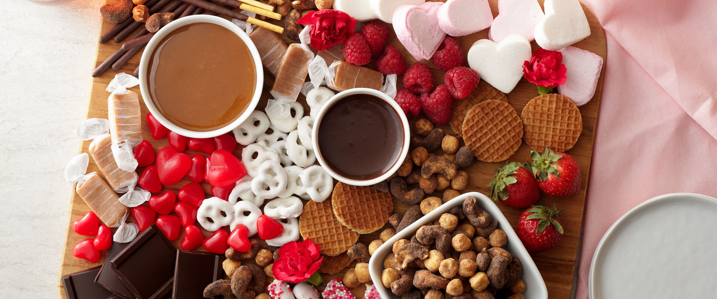 Galentines Day Dessert Board featuring sweets and hints of red and pink
