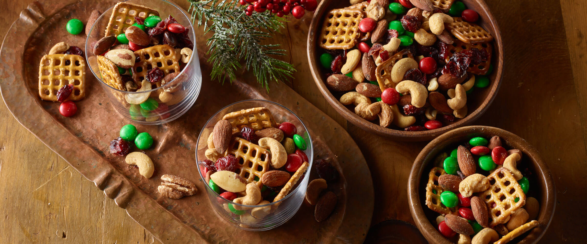 Overhead view of a homemade trail mix with pretzels, nuts and dried fruit