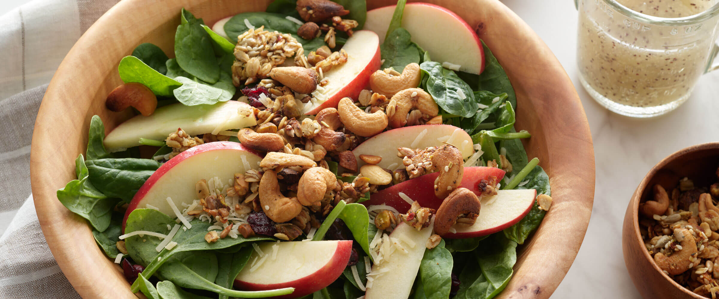autumn salad with savory granola overhead shot of the bowl on the table
