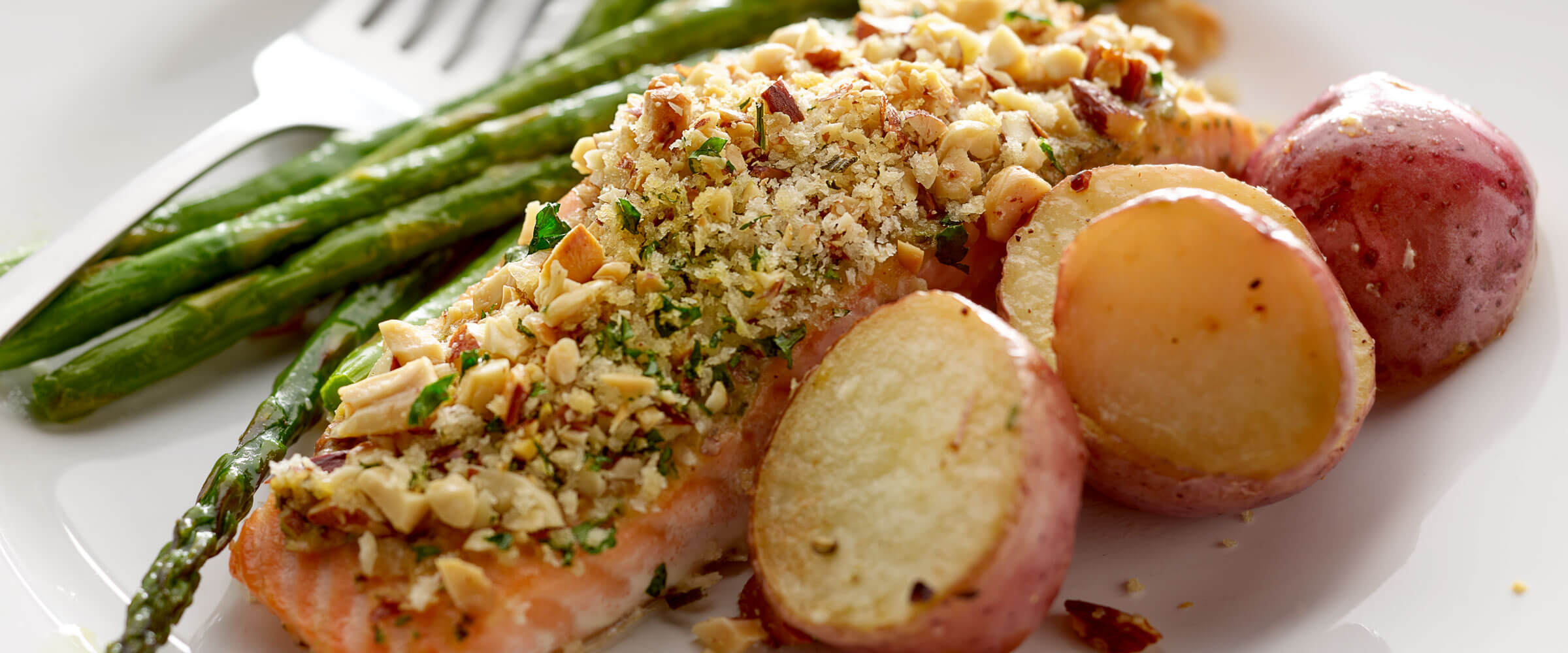 mixed nut crusted salmon recipe on a plate