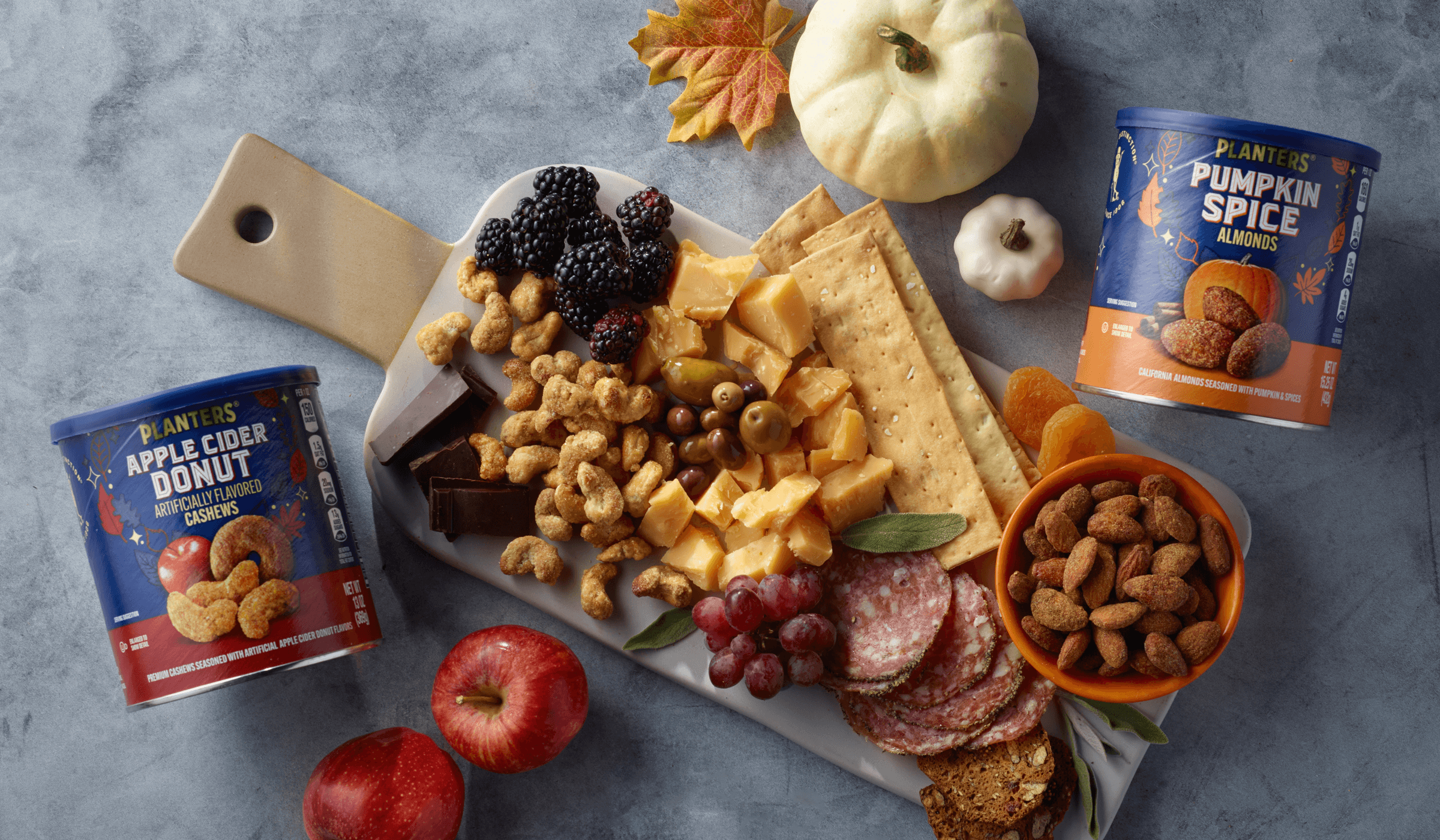 Apple cider cashews and pumpkin almond promotional photoshoot with fall decor