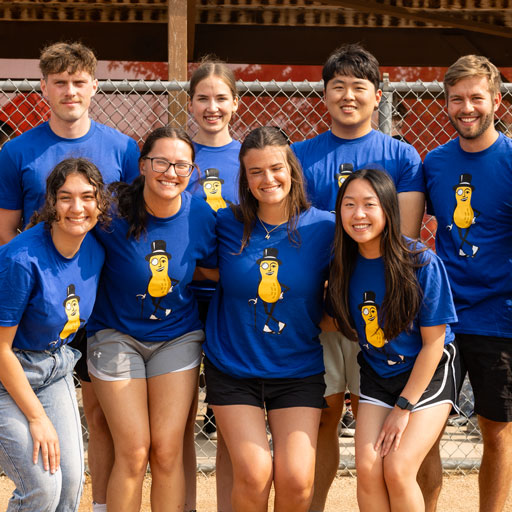 Planters team smiling together in matching T-shirts