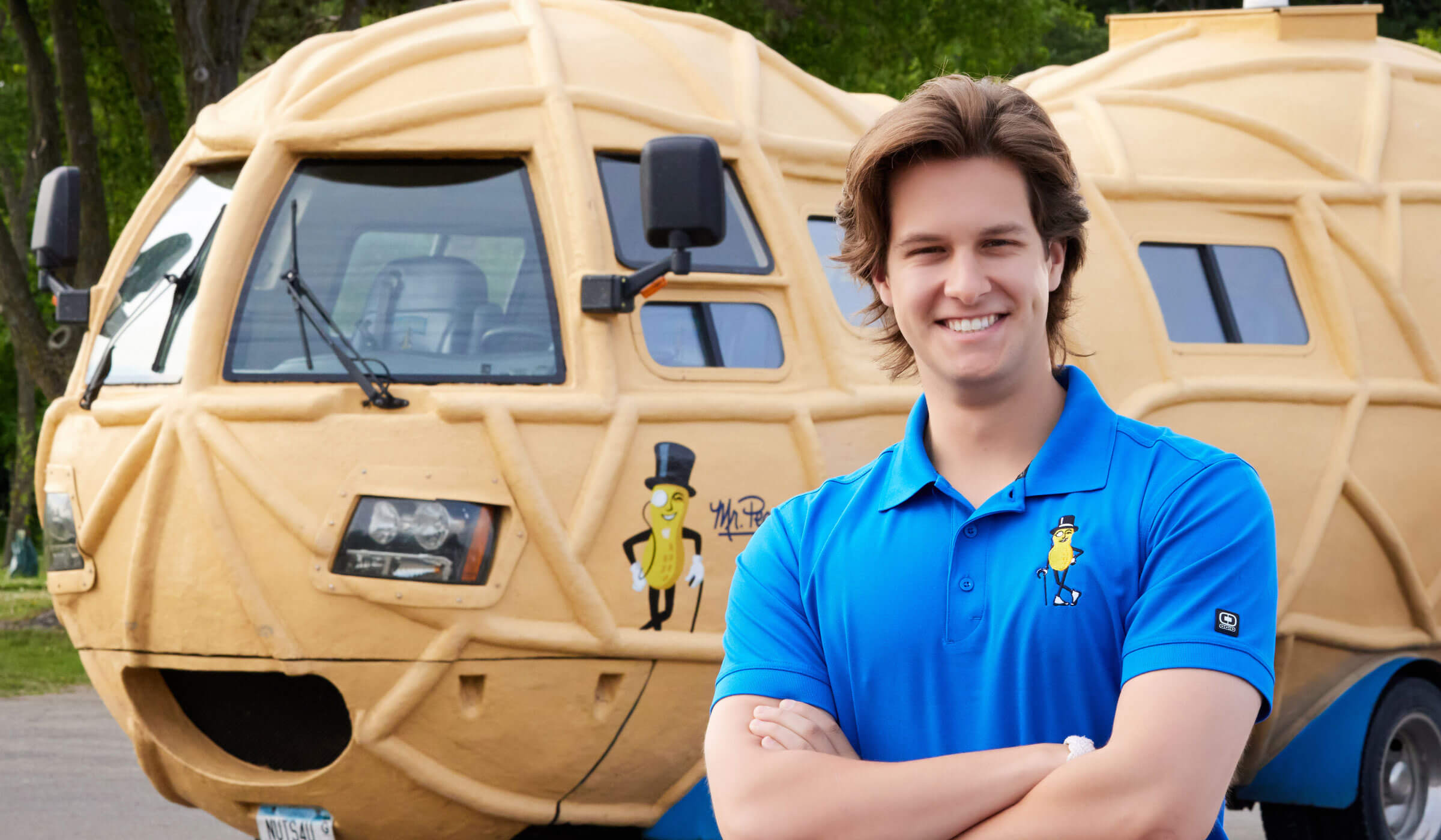 Lady smiling in front of the planters nutmobile